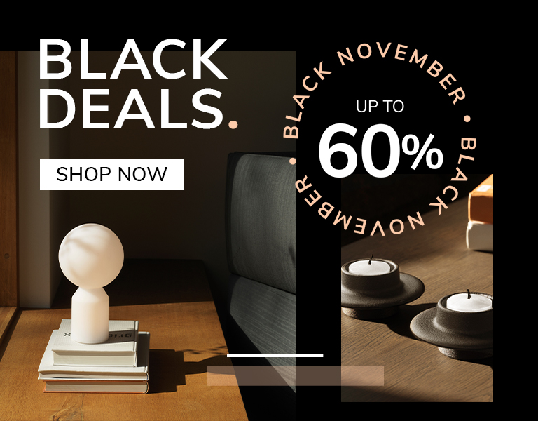 Elegant designer table lamp on natural stone base with gold stem and white shade, promoting Black November sale – up to 40% off with text ‘First Black Deals’ and ‘Discover More’ button.